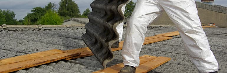 workers removing asbestos roof